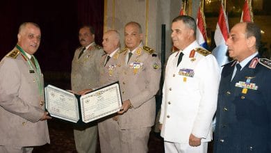 Photo of Sisi Sacks Maj. Gen. El-Keshky with a US Directive